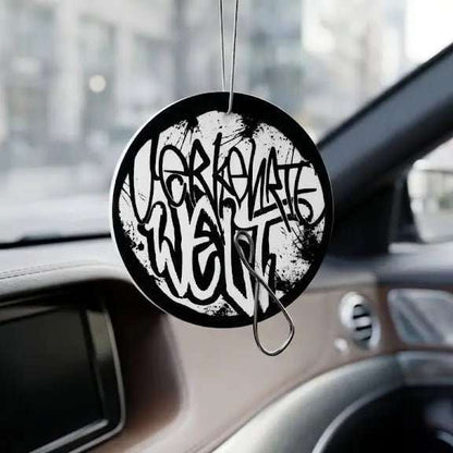 Car Freshener Well with graffiti-style design hanging in a vehicle.