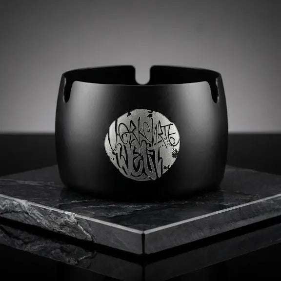 Black ceramic bracelet featuring a unique silver logo design, perfect for stylish accessories.