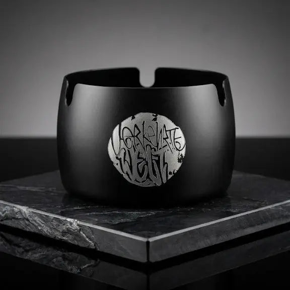 Black ceramic bracelet featuring a unique silver logo design, perfect for stylish accessories.