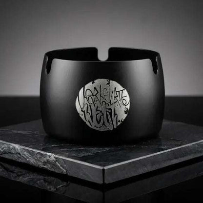 Black ceramic bracelet featuring a unique silver logo design, perfect for stylish accessories.